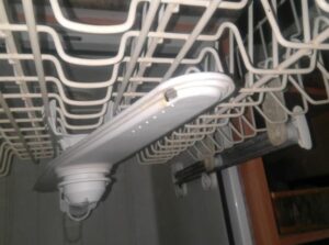 cleaning the dishwasher spray arm