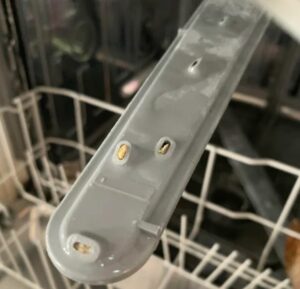 clogged spray arm