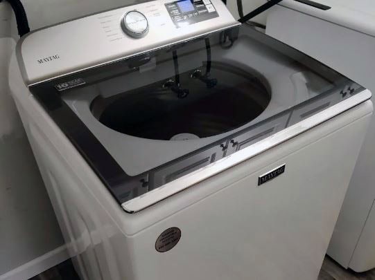 maytag washer empty top loader