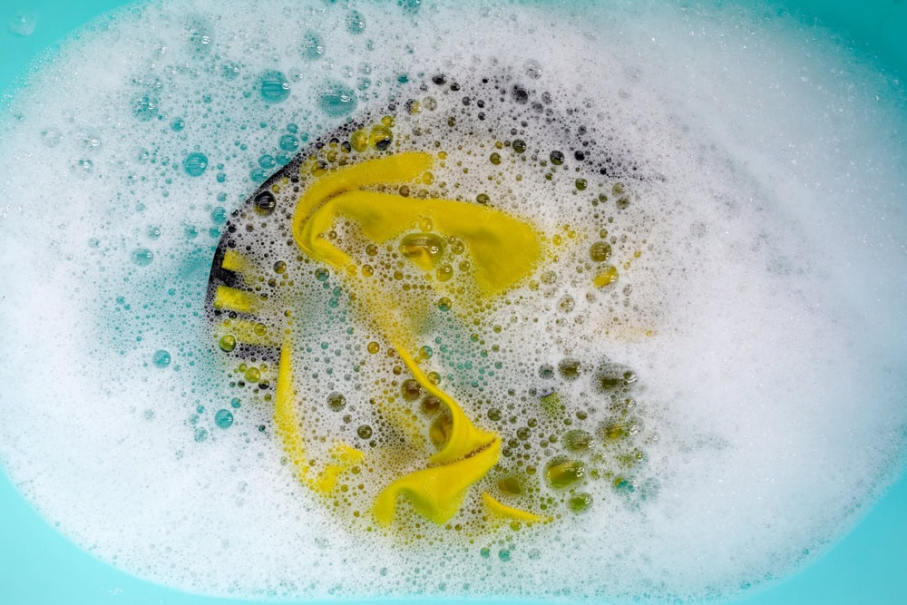 clothes in soapy water