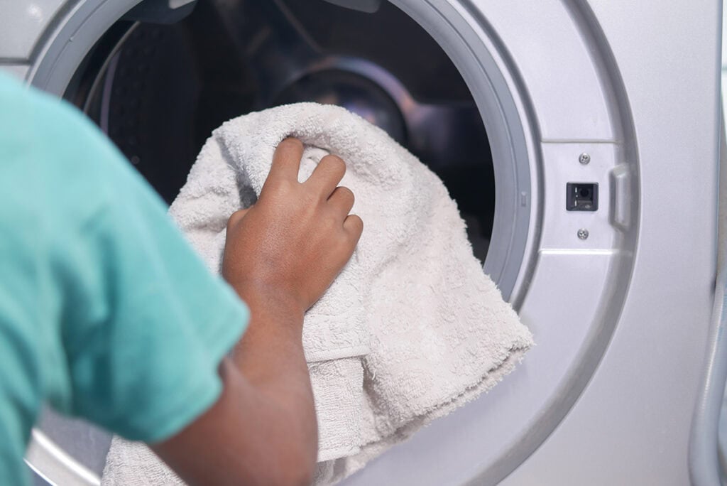 put towel in washer