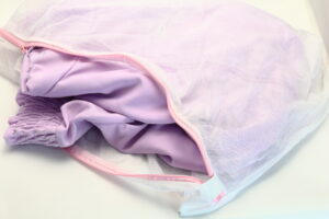 put garment in laundry bag