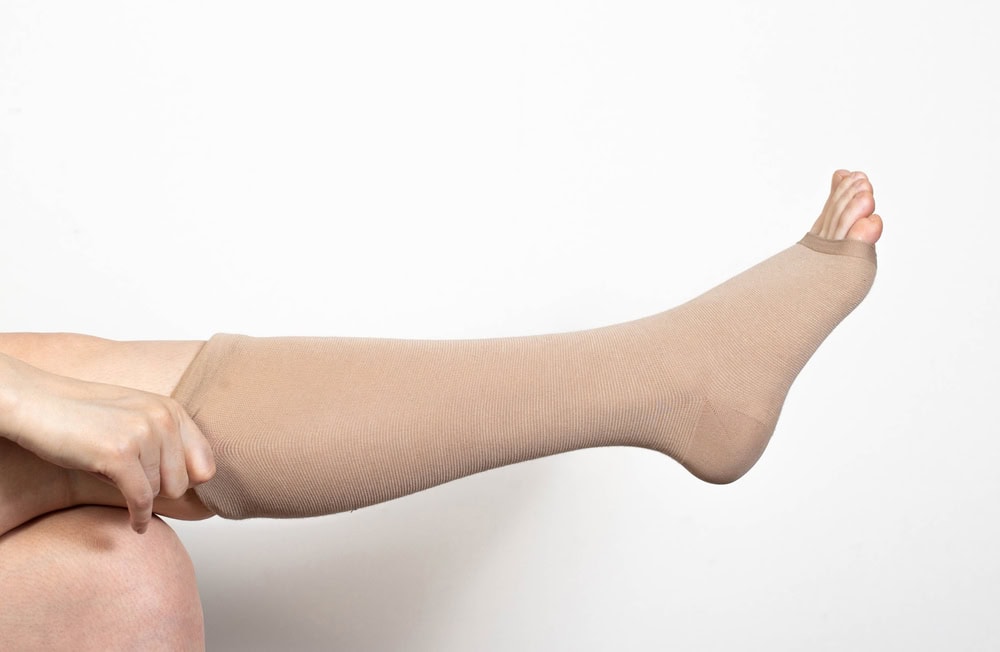 putting on compression stockings