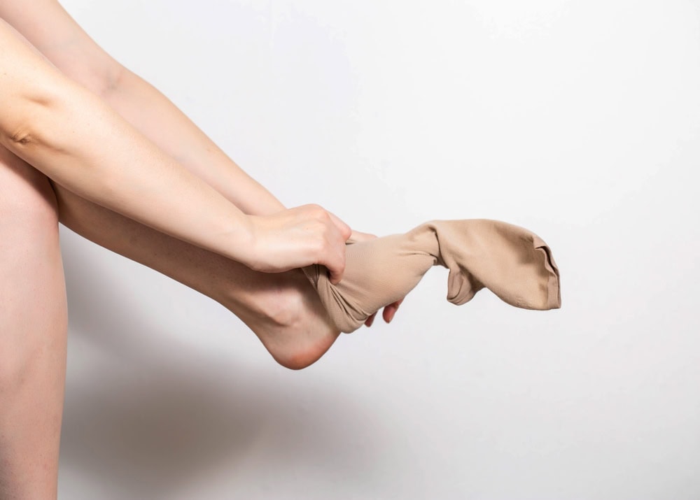 slide stockings into toes